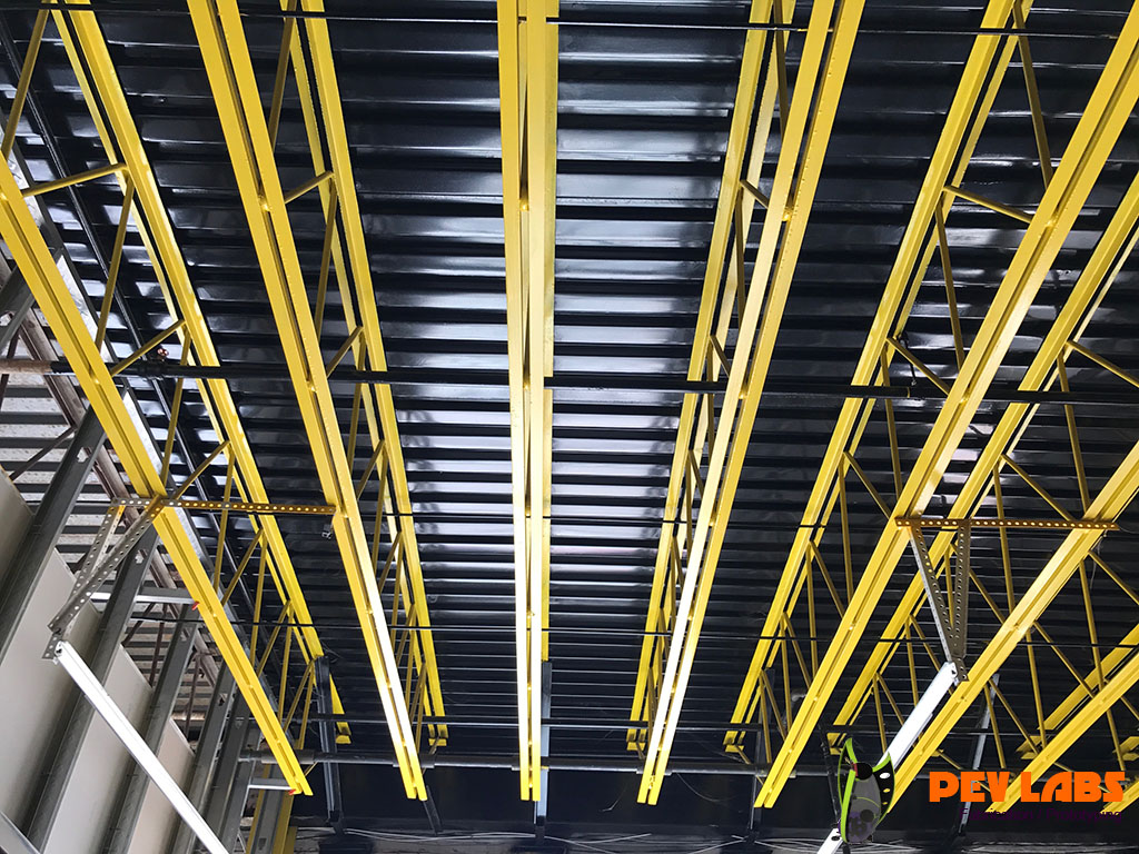 Corrugated Metal Ceiling and Trusses Treated with Rustoleum Paint PEV Labs for Electric Vehicle Repair
